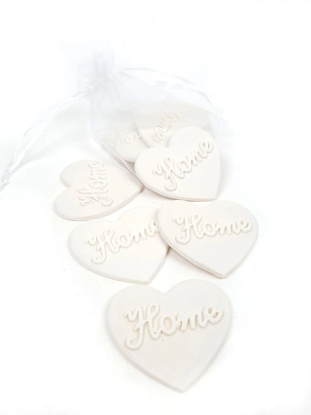 Polyresin home teli szív zsákban